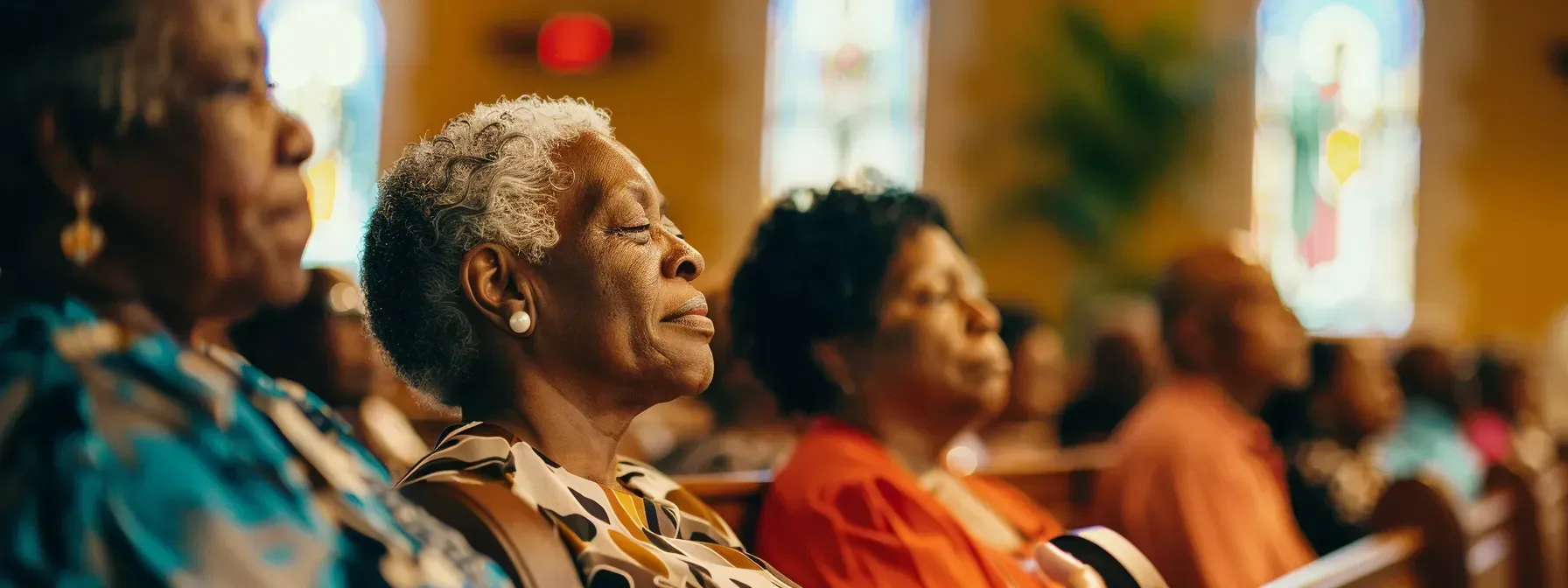 A group of older women are sitting in a church.