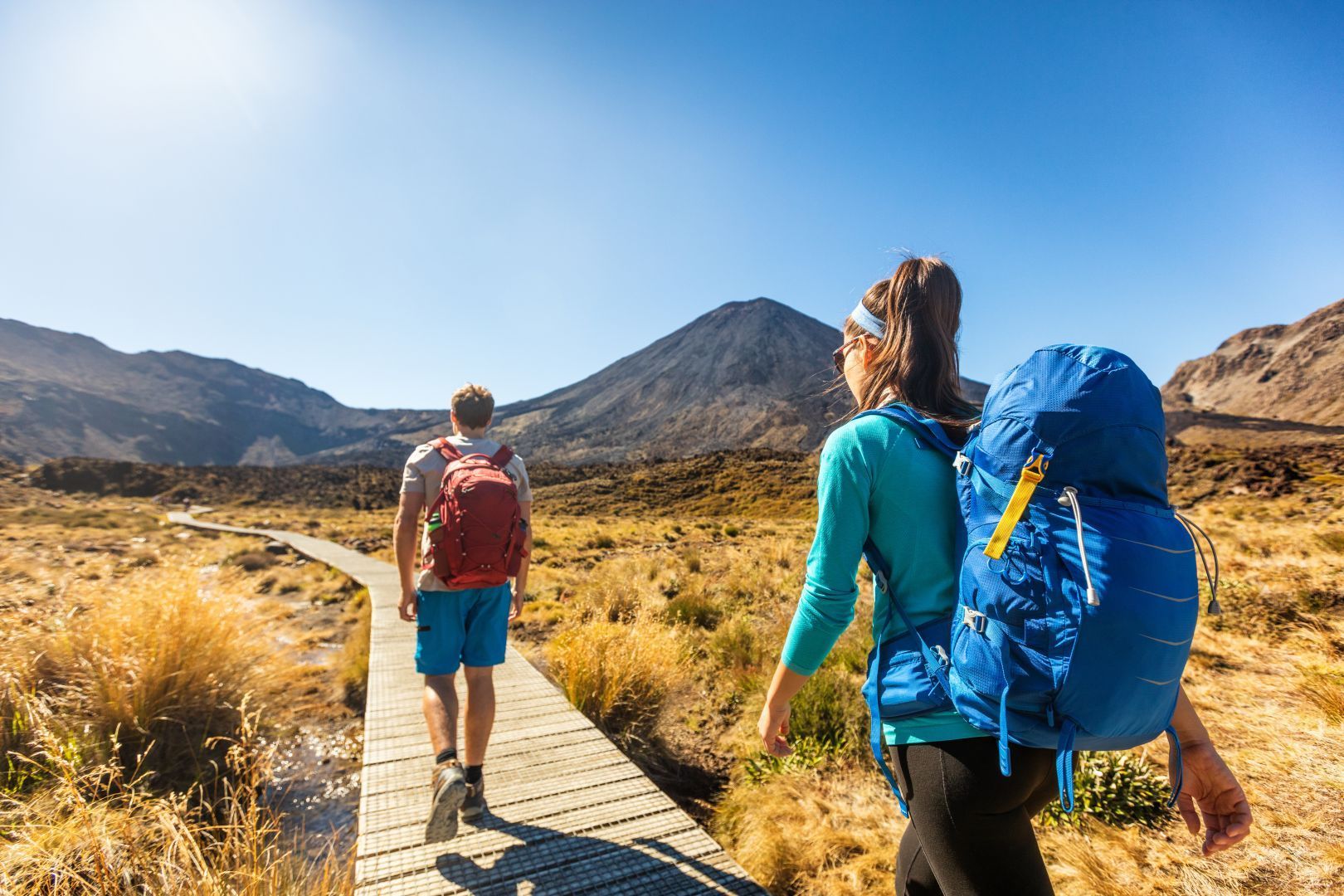 A couple starting the Tongariro Alpine Crossing on a fine day