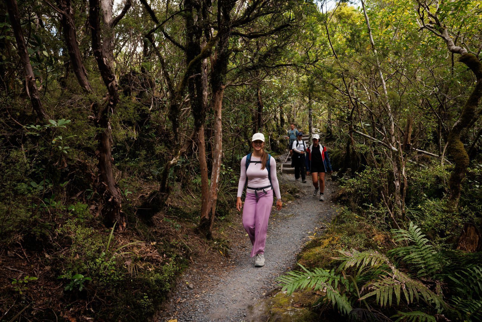 A group of hikers on the final stretch of the the Tongariro Alpine Crossing to the Ketetahi carpark