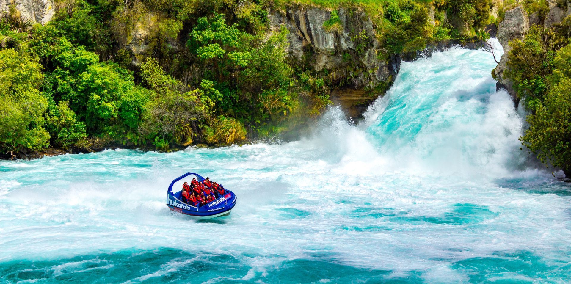 A jet boat in the white wash of the Huka Falls in Tapuo