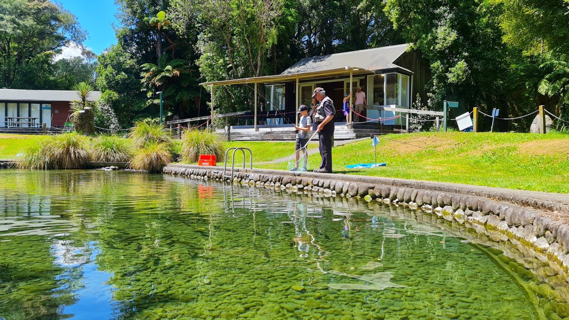 Two visitors to the National Trout Centre in Turangi