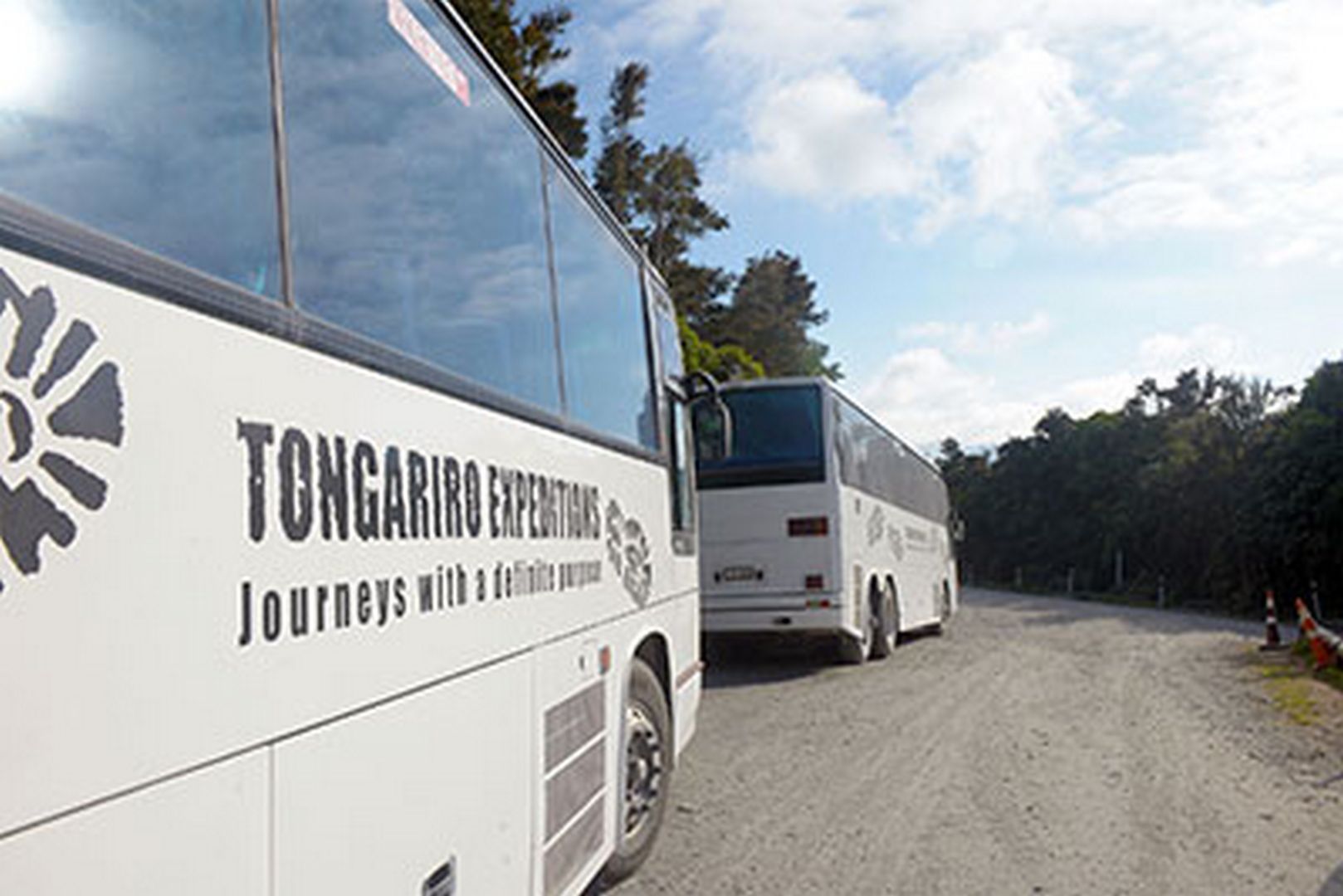 Tongariro Expeditions shuttle buses transporting people to the start of the Tongariro Alpine Crossing