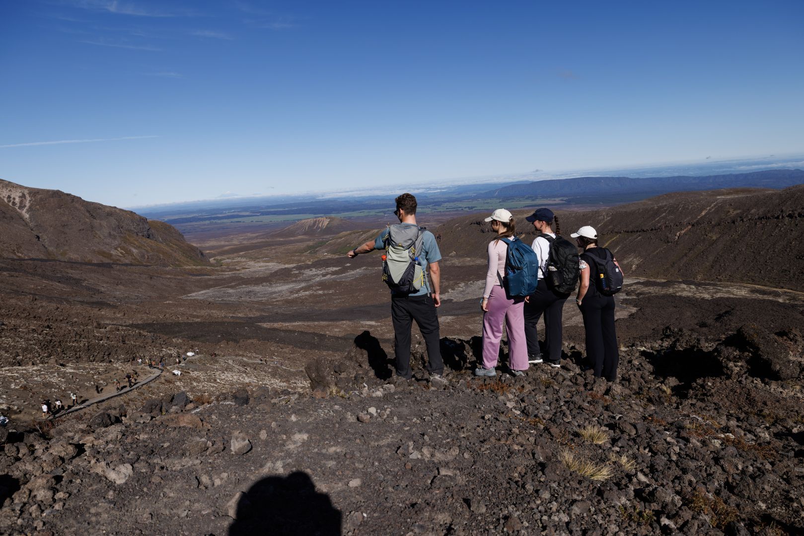 A group of people at the top of the Devil's Staircase on the Tongariro Alpine Crossing