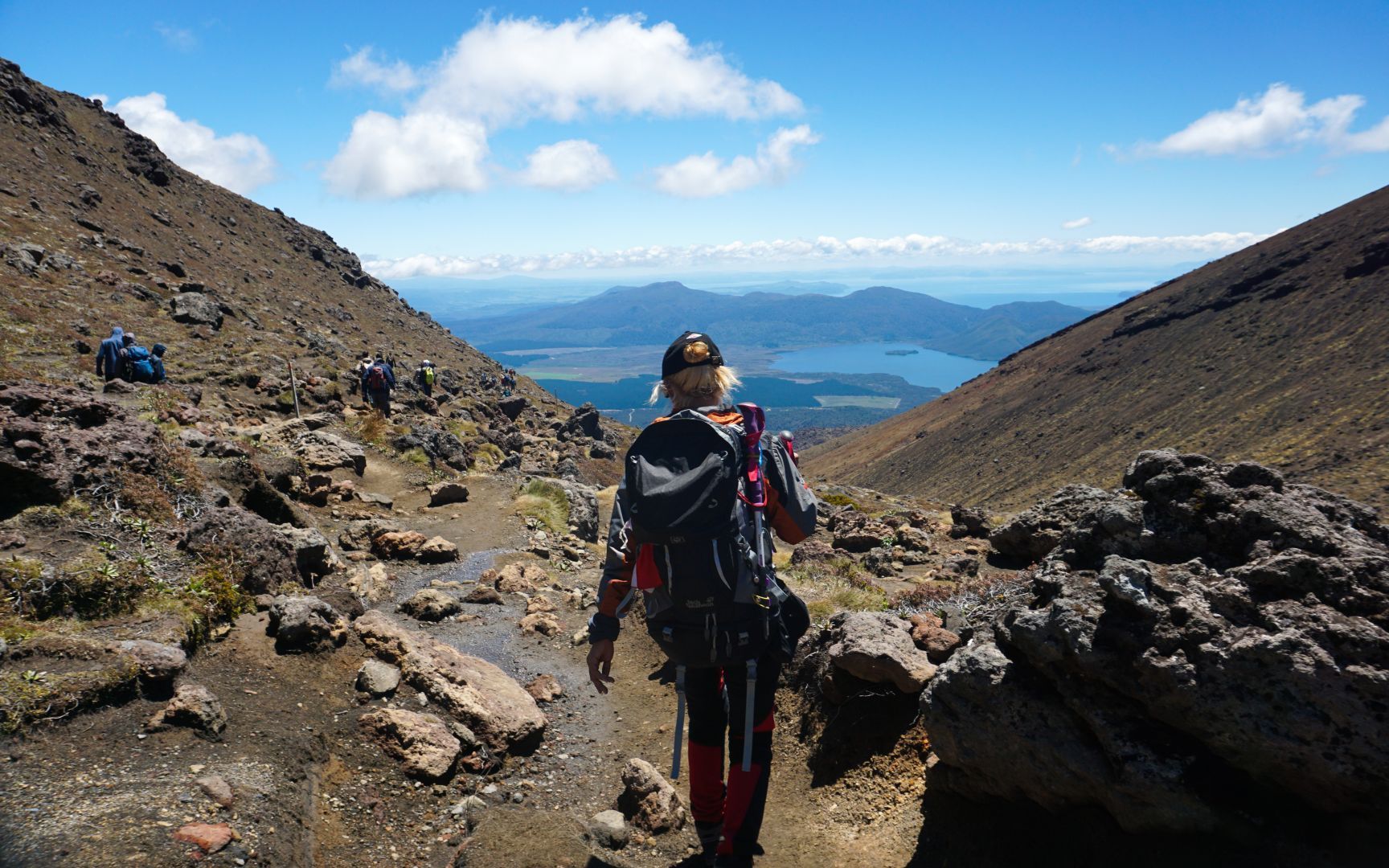 A woman hiking the Tongariro Alpine Crossing