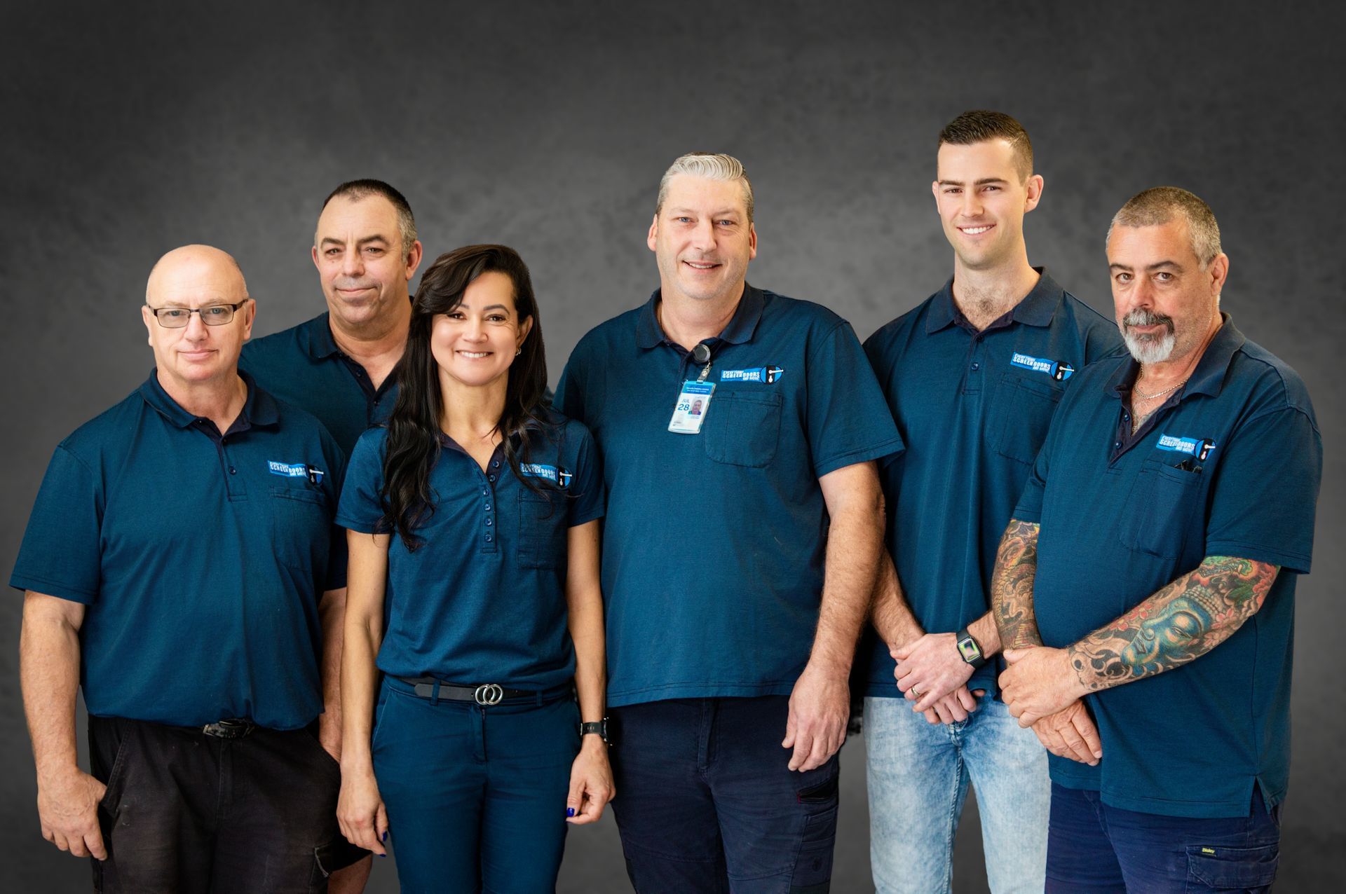 Group of Six People in Matching Blue Shirts — Everything Screendoors & More In Wollongong, NSW