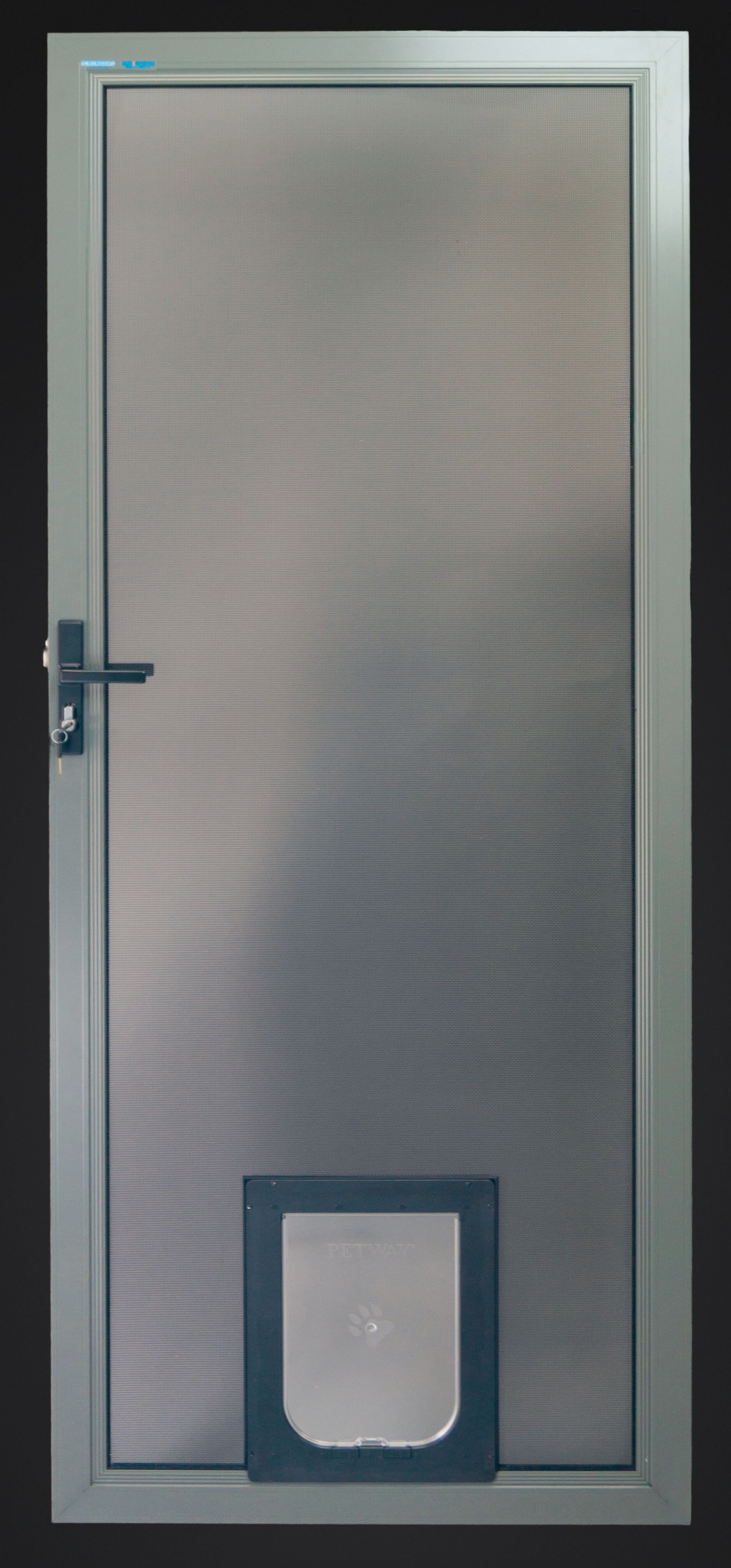 A grey screen door with a built-in pet door — Everything Screendoors & More In Wollongong, NSW