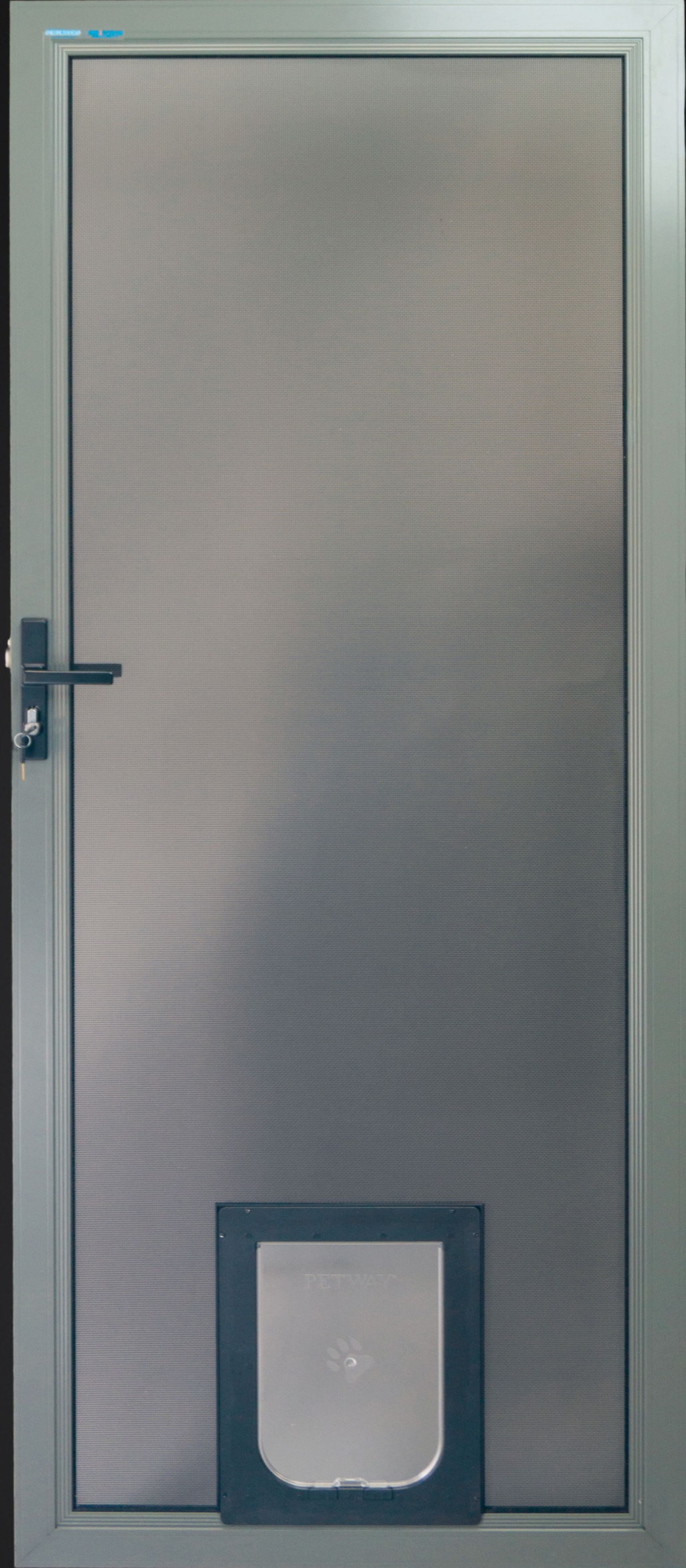 Metal screen door with a pet door in it — Everything Screendoors & More In Wollongong, NSW