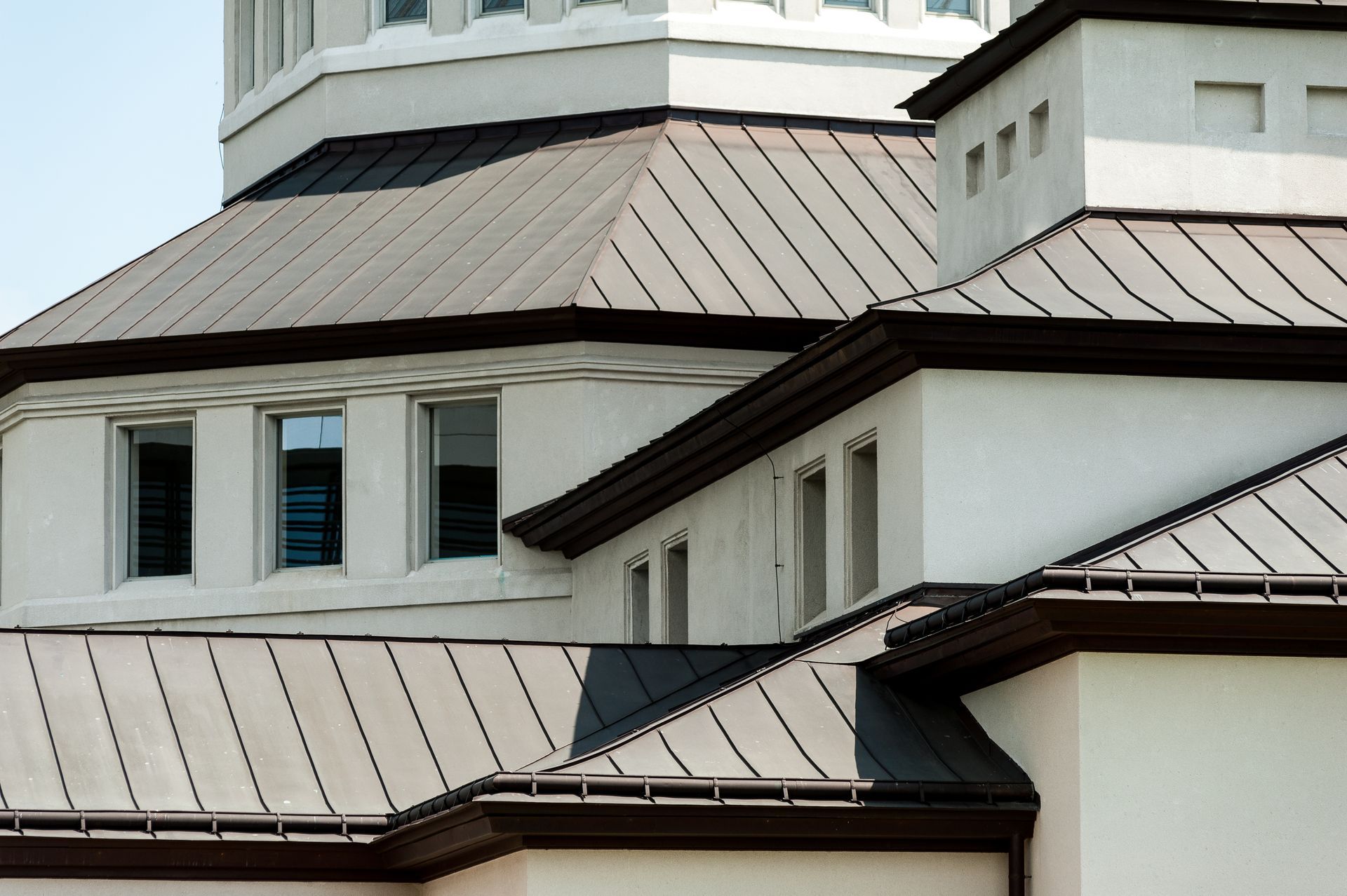 White Building With a Brown Metal Roof — JLH Plumbing, Gas & Roofing in South Nowra, NSW