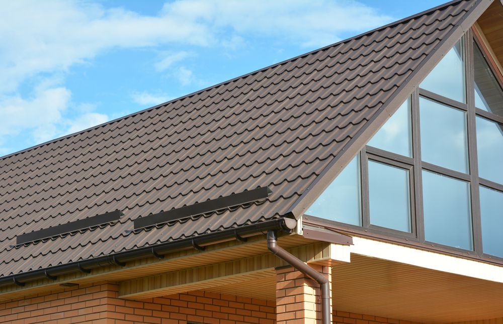 Brown Metal Roof With Gutter and Triangular Windows — JLH Plumbing, Gas & Roofing in Vincentia, NSW