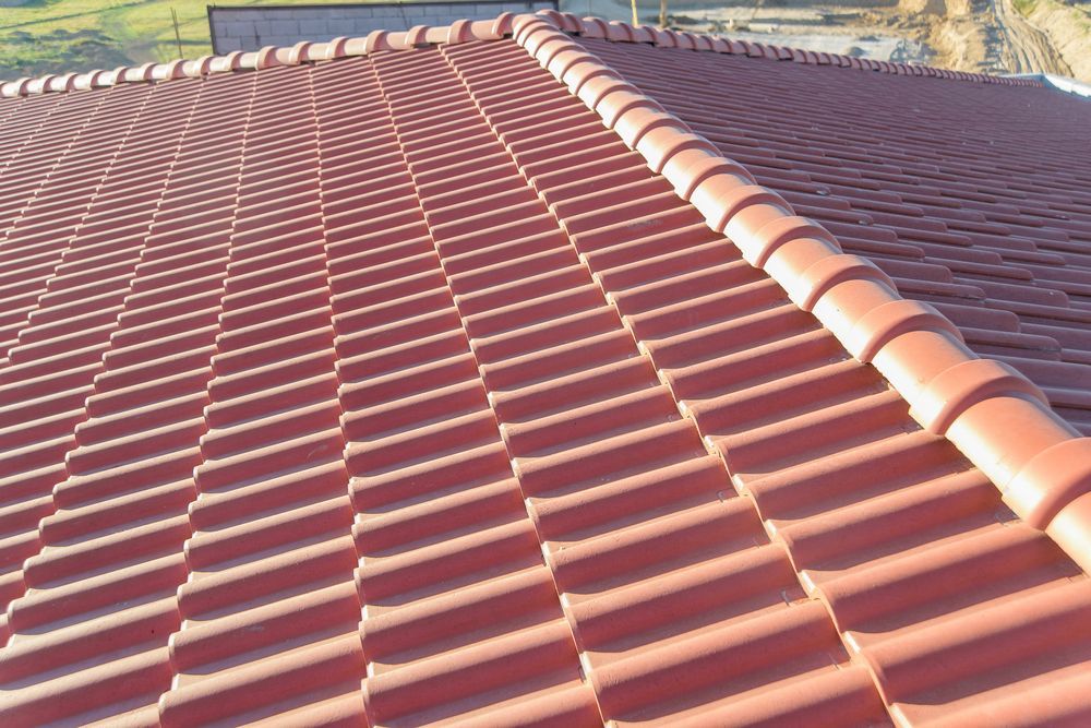 Red Ceramic Roof Tiles on a Pitched Roof — JLH Plumbing, Gas & Roofing in Ulladulla, NSW