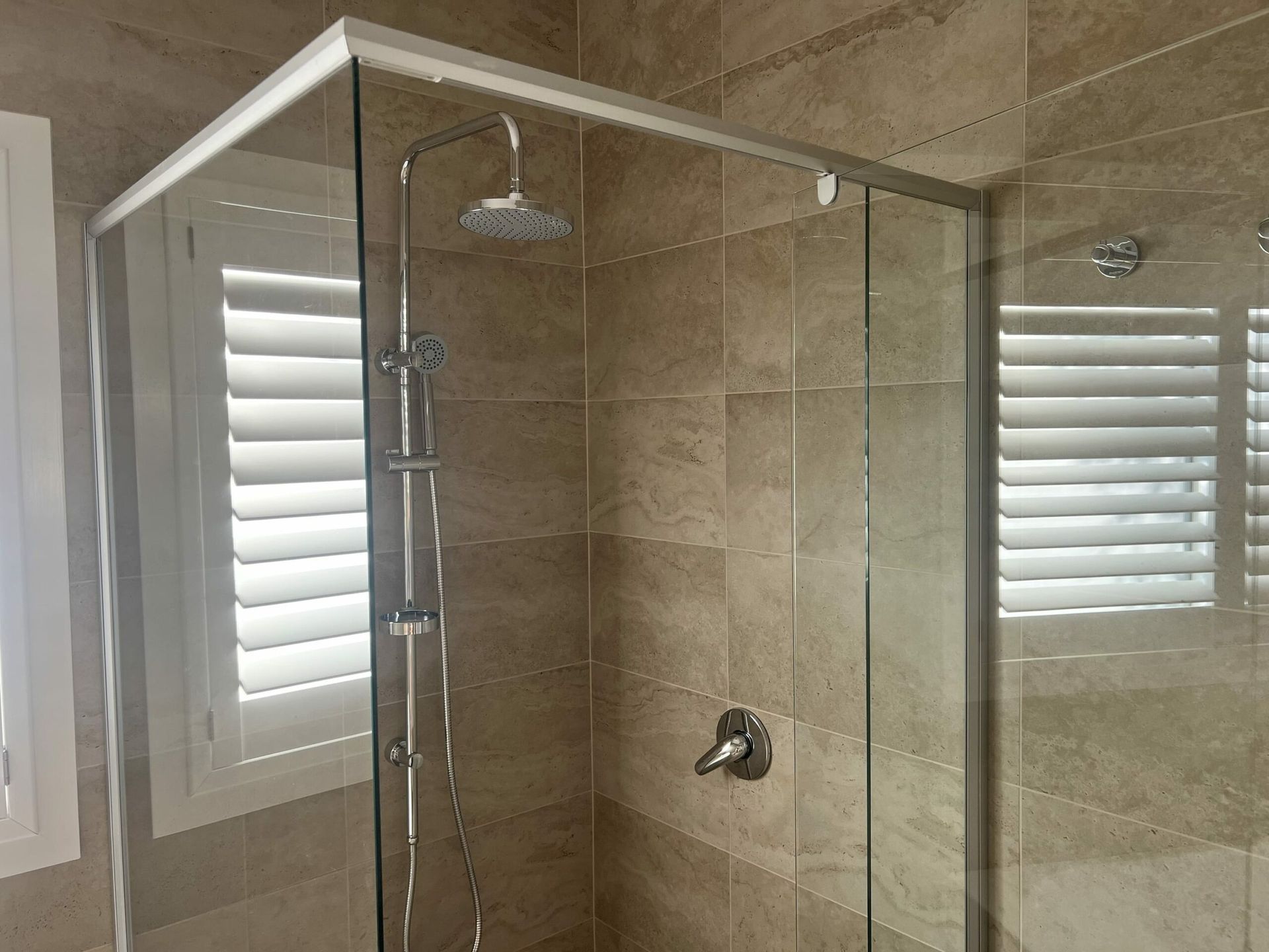 Shower Stall With Glass Doors, Chrome Fixtures — JLH Plumbing, Gas & Roofing in Wollongong, NSW
