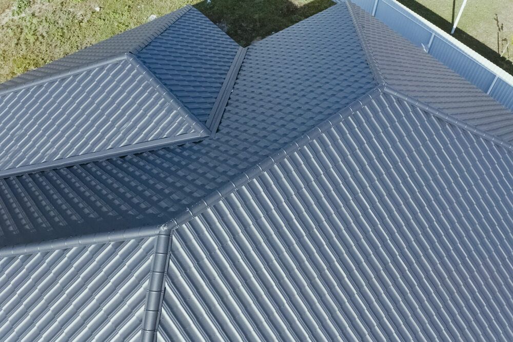 A Close Up Of A Stack Of Stainless Steel Angles — Fullerton's Plumbing Manufacture In Woree, QLD