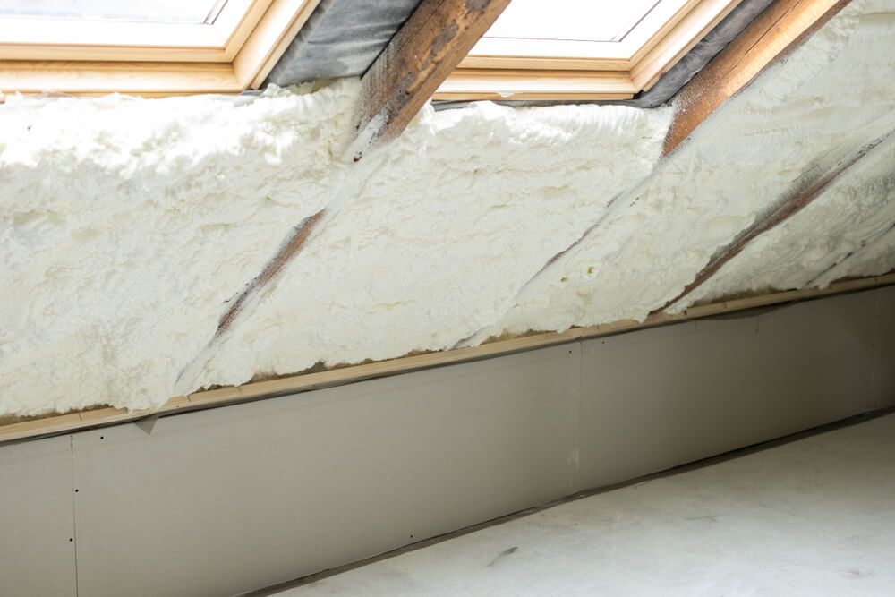A Room With a Roof Window and Foam Insulation — Fullerton's Plumbing Manufacture In Woree, QLD