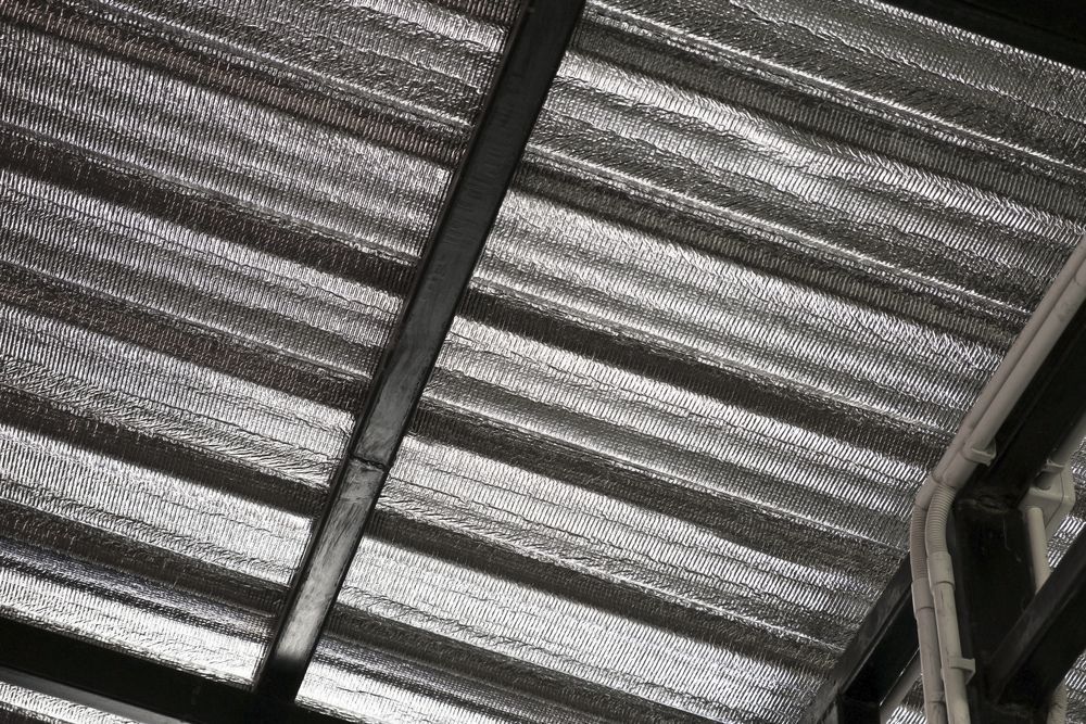 A Close Up Of A Roof With Aluminum Foil On It — Fullerton's Plumbing Manufacture In Woree, QLD