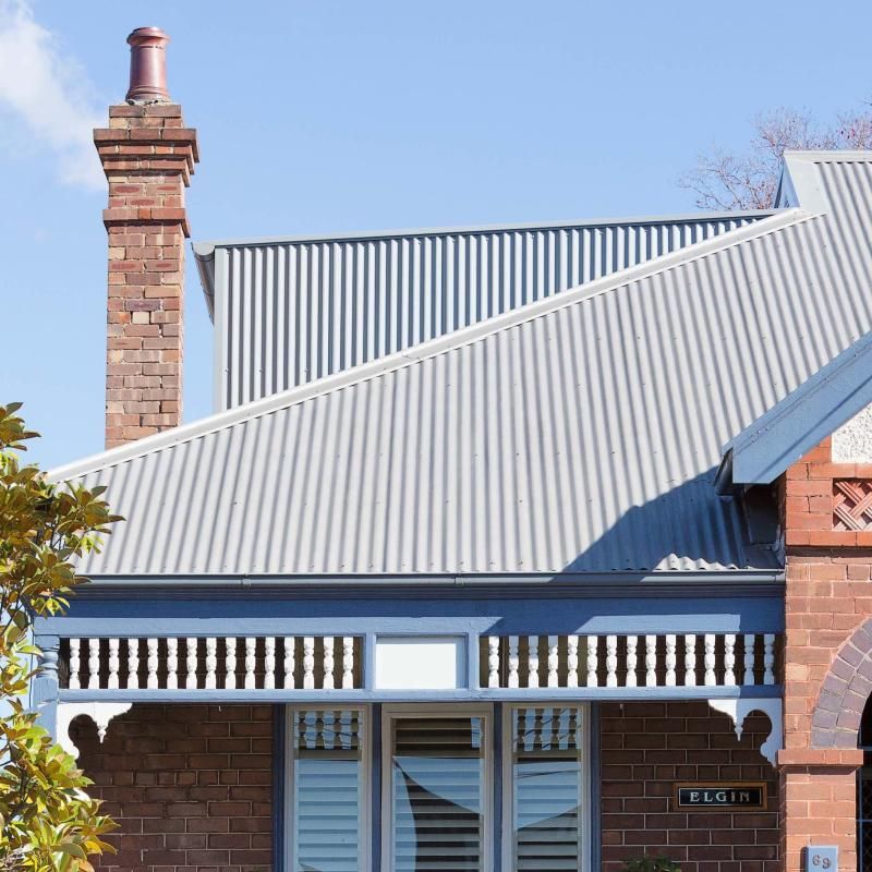 House Roof With Dark Purple Shingles — Fullerton's Plumbing Manufacture In Woree, QLD
