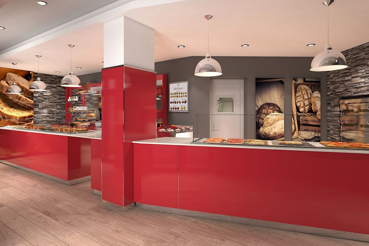 Modern bakery interior with a long red counter, display cases, and hanging pendant lights