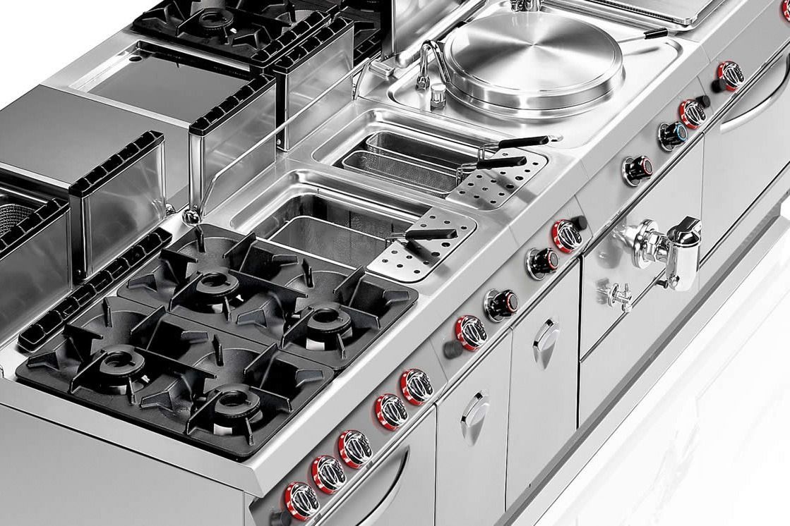 Stainless steel built-in gas cooktop with multiple burners and control knobs on the side.