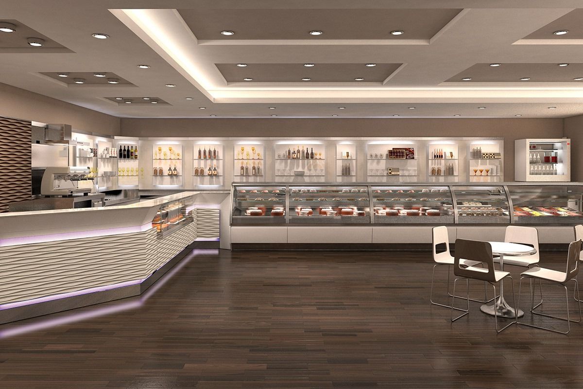 Modern beauty salon interior with white counters, dark wood floors, and styling chairs under bright ceiling lights