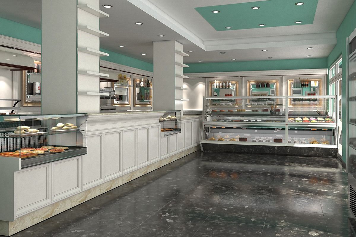 Empty bakery or buffet counter with glass display cases, white cabinets, and teal ceiling accents