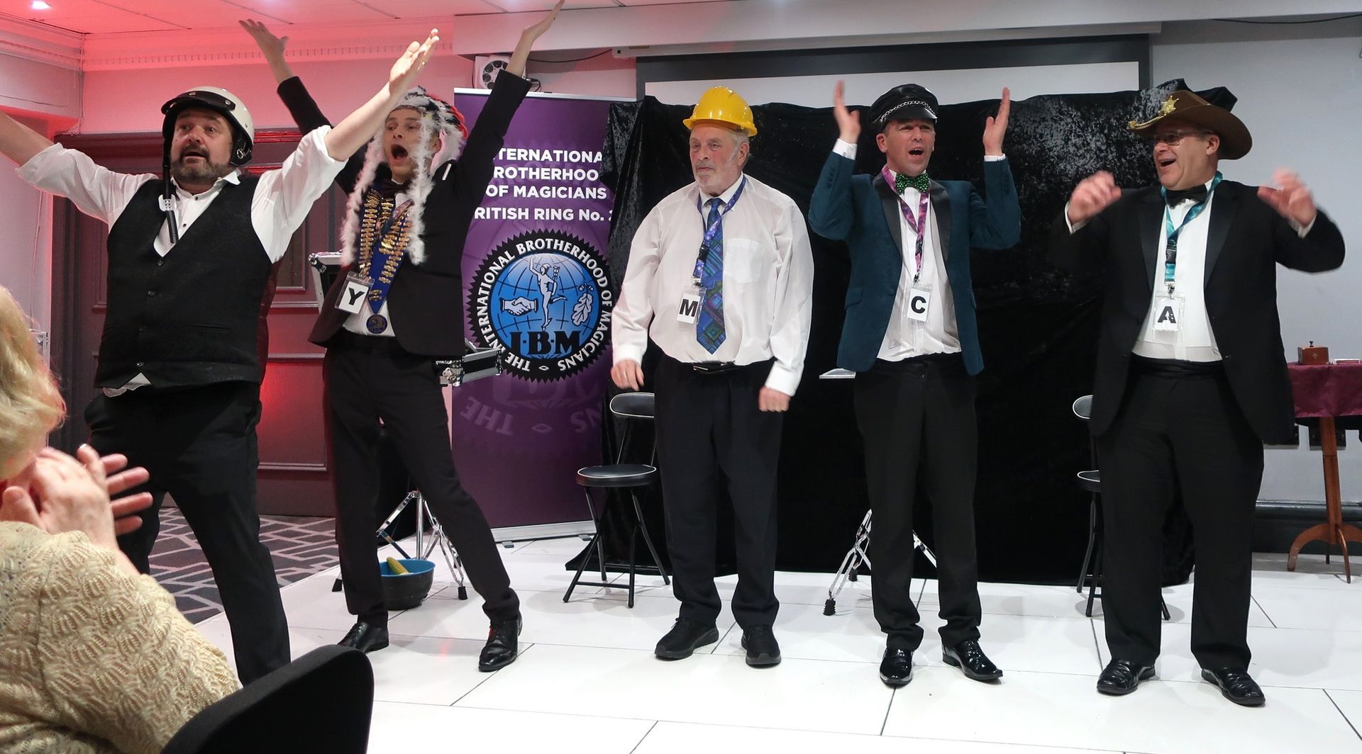 Paul Roberts performing a stage magic show at a Manchester corporate gala.