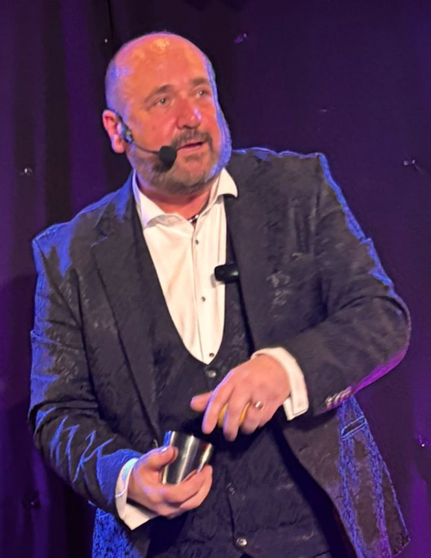 Exhibition Magician Paul Roberts, drawing in potential leads at a trade show event.