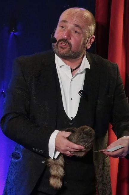 Paul Roberts Magician performing on Public Transport