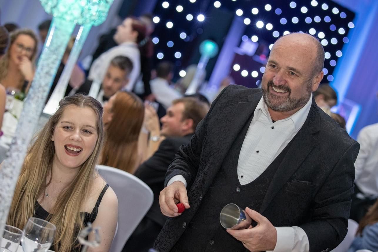 Chester Magician Paul Roberts creating wonder at a private Chester Christmas Party.