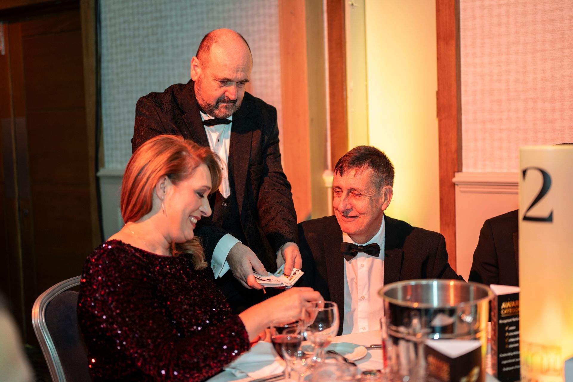 Paul performing his close-up table magic for business people at a Stoke event.