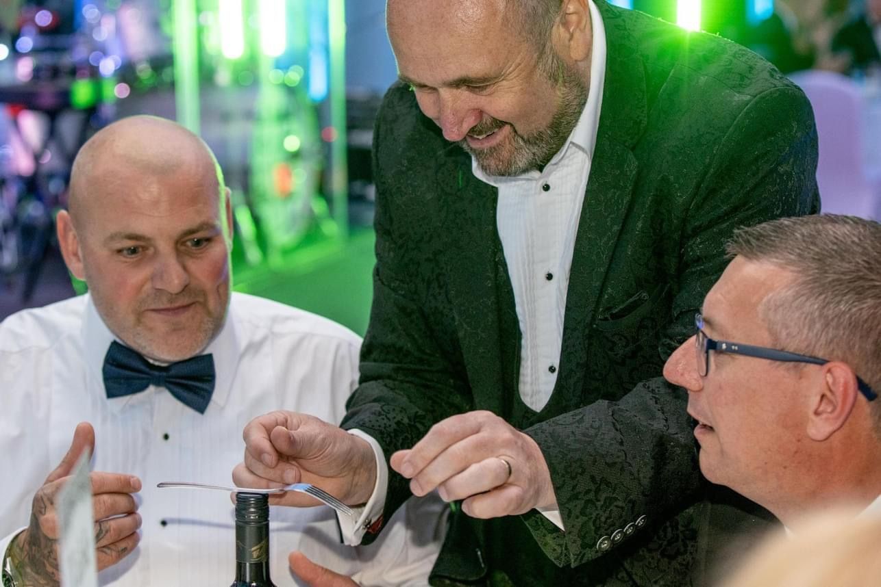 Paul enthralling guests at a posh corporate event in Cheshire.