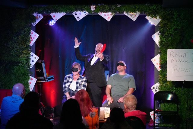 Stage magician Paul Roberts, mesmerising people at a corporate event in Rossett
