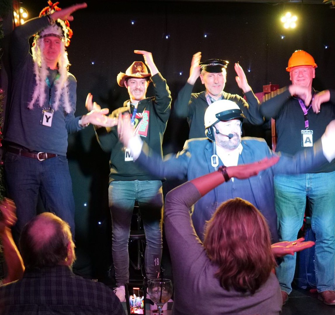 Fun Family magician performing at a corporate party.