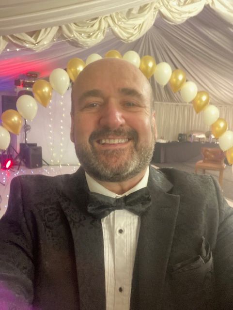 Paul Roberts presenting his unique Magical Wedding Emcee Toastmaster experience to a wonderful couple.