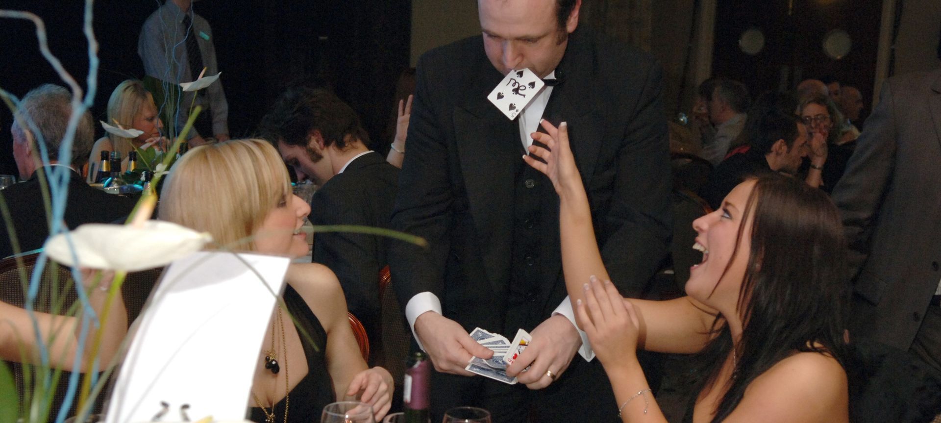 Race day magician Paul Roberts entertaining guests in the private function rooms at Chester Racecourse