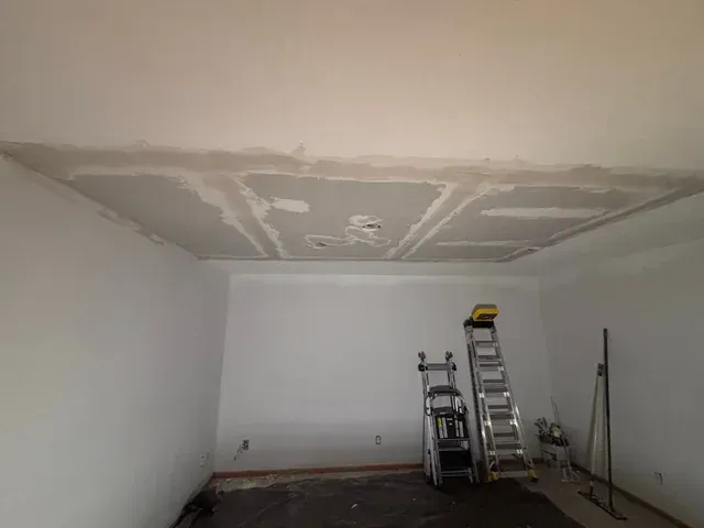 Ceiling drywall patch with joint compound during repair