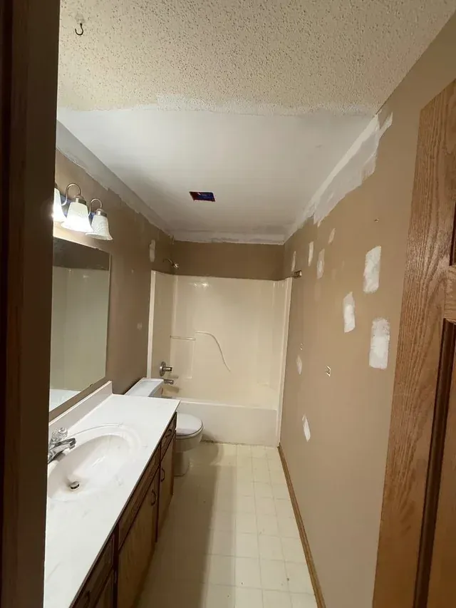 Bathroom ceiling joint treatment and wall patches in Chanhassen