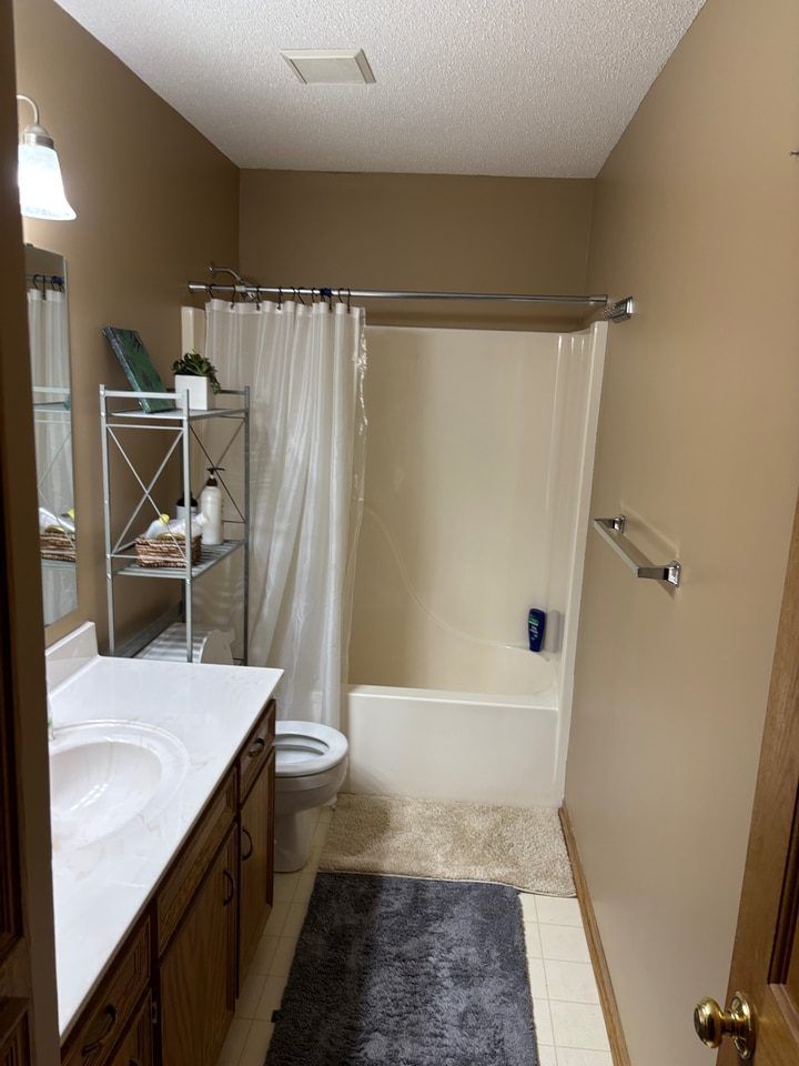 Painted bathroom walls and ceiling with the ventilation grille in place.
