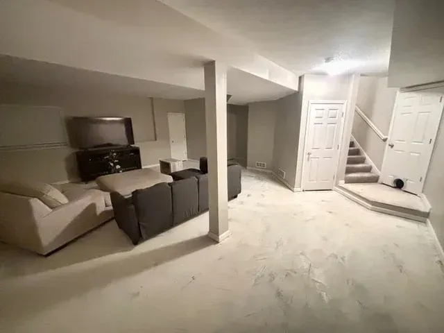 Painted walls and trim with bare floor substrate in St. Michael