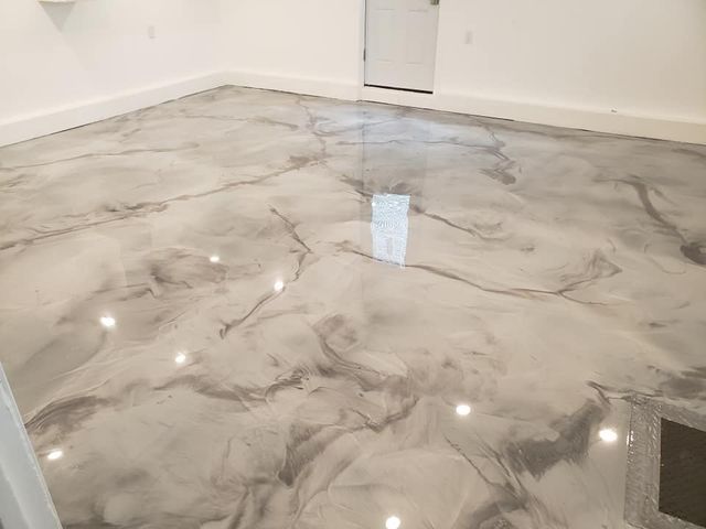 a room with a marble floor and a door .