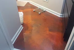 a bathroom with a scale on the floor .