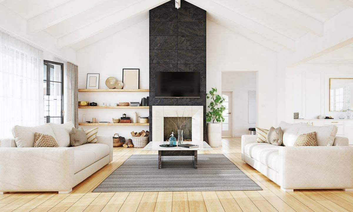 A living room filled with furniture and a fireplace.