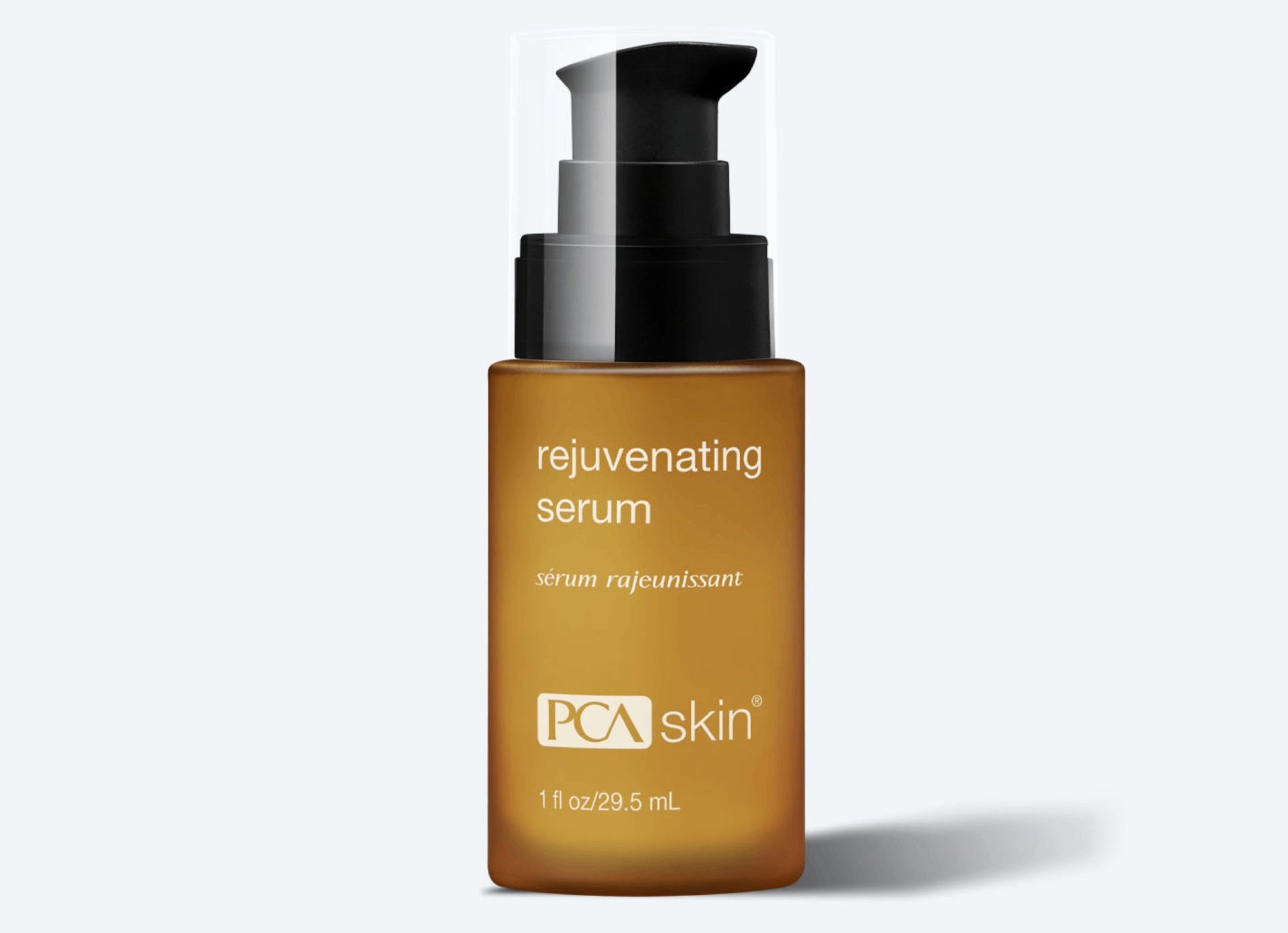 A bottle of pca skin rejuvenating serum on a white background