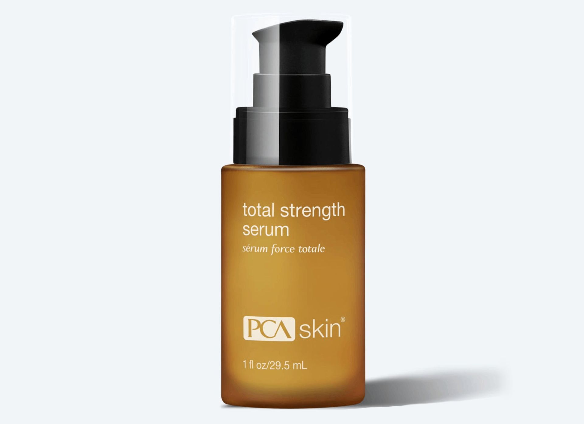 A bottle of pca skin total strength serum on a white background.