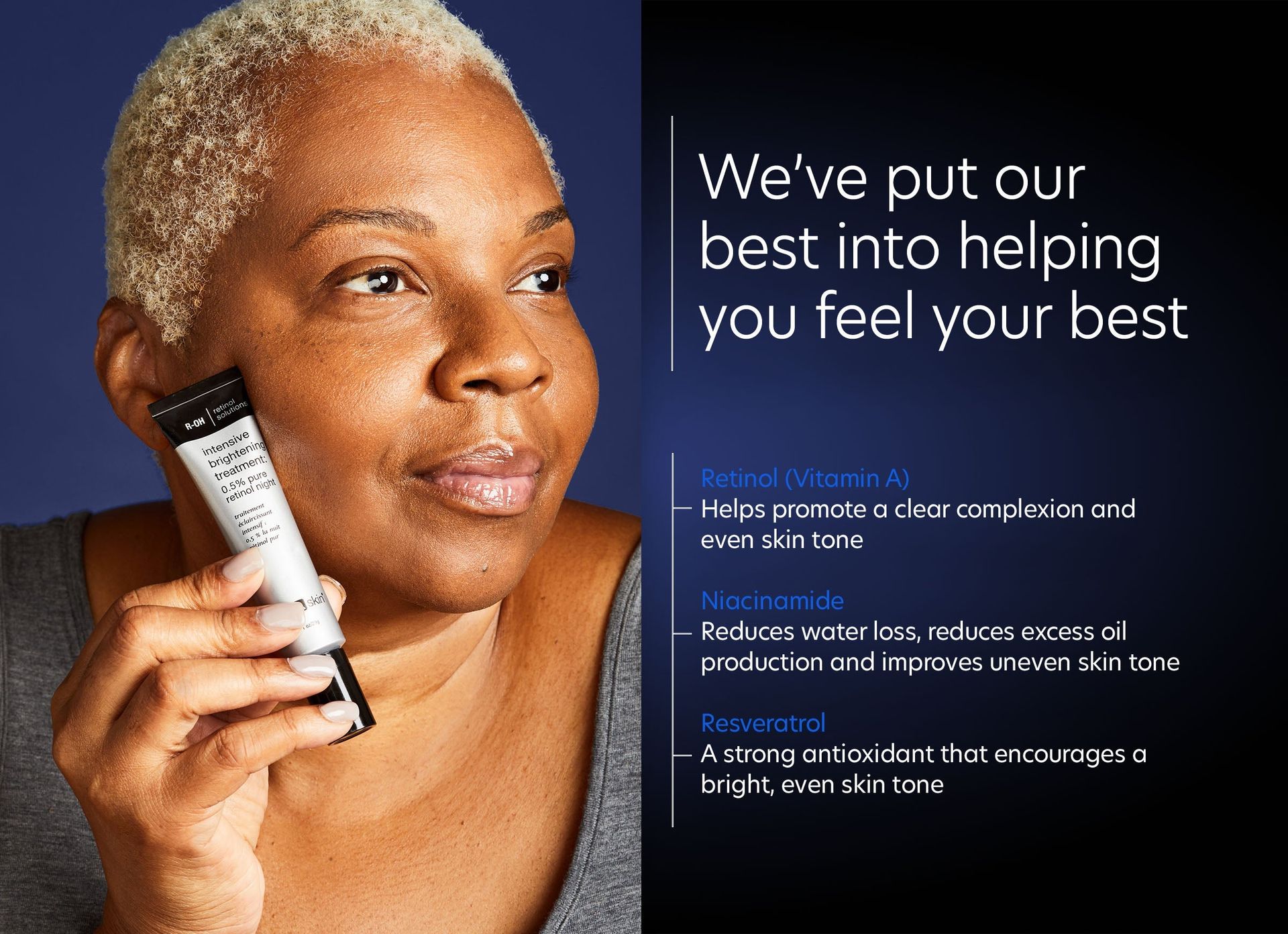 A woman is holding a tube of lotion in her hand.