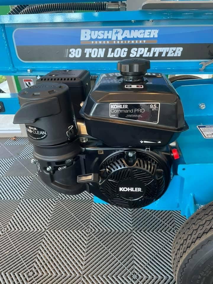 A Blue Log Splitter With a Kohler Engine is Sitting on a Tiled Floor — Ireland's Machinery Pty Ltd In Braemar, NSW