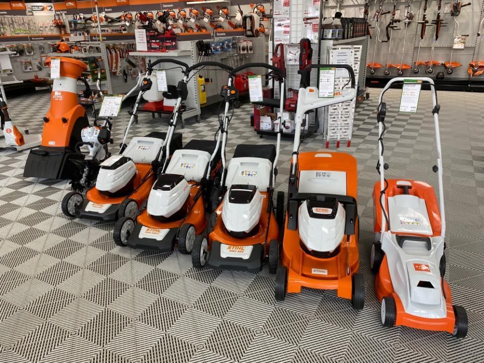 A Row of Lawn Mowers Are Lined Up in a Store — Ireland's Machinery Pty Ltd In Braemar, NSW