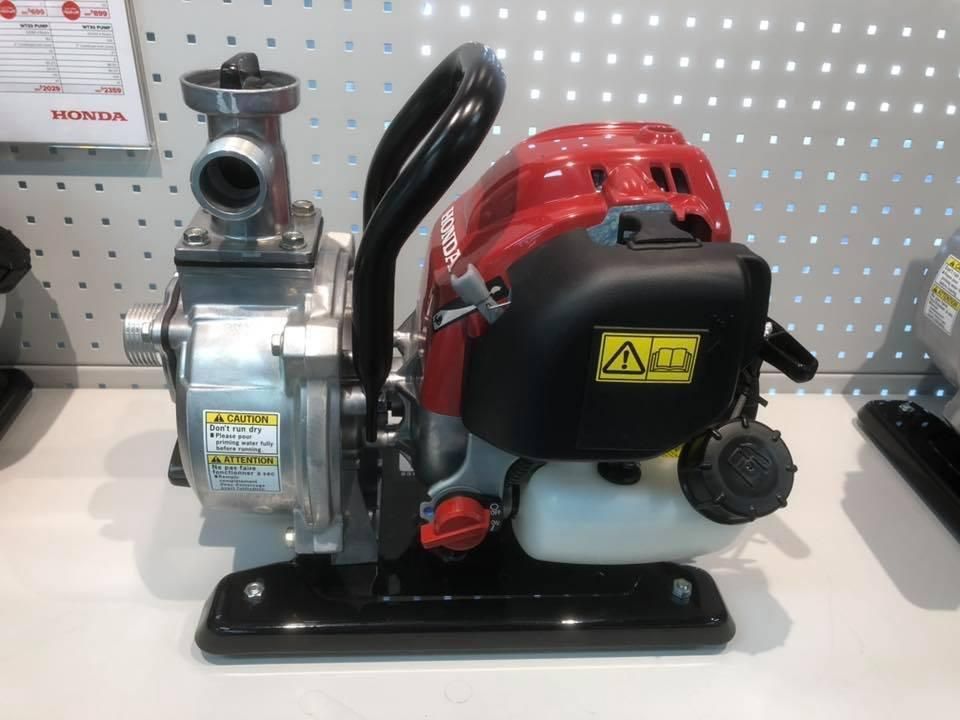 A Honda Water Pump is Sitting on a Table — Ireland's Machinery Pty Ltd In Braemar, NSW