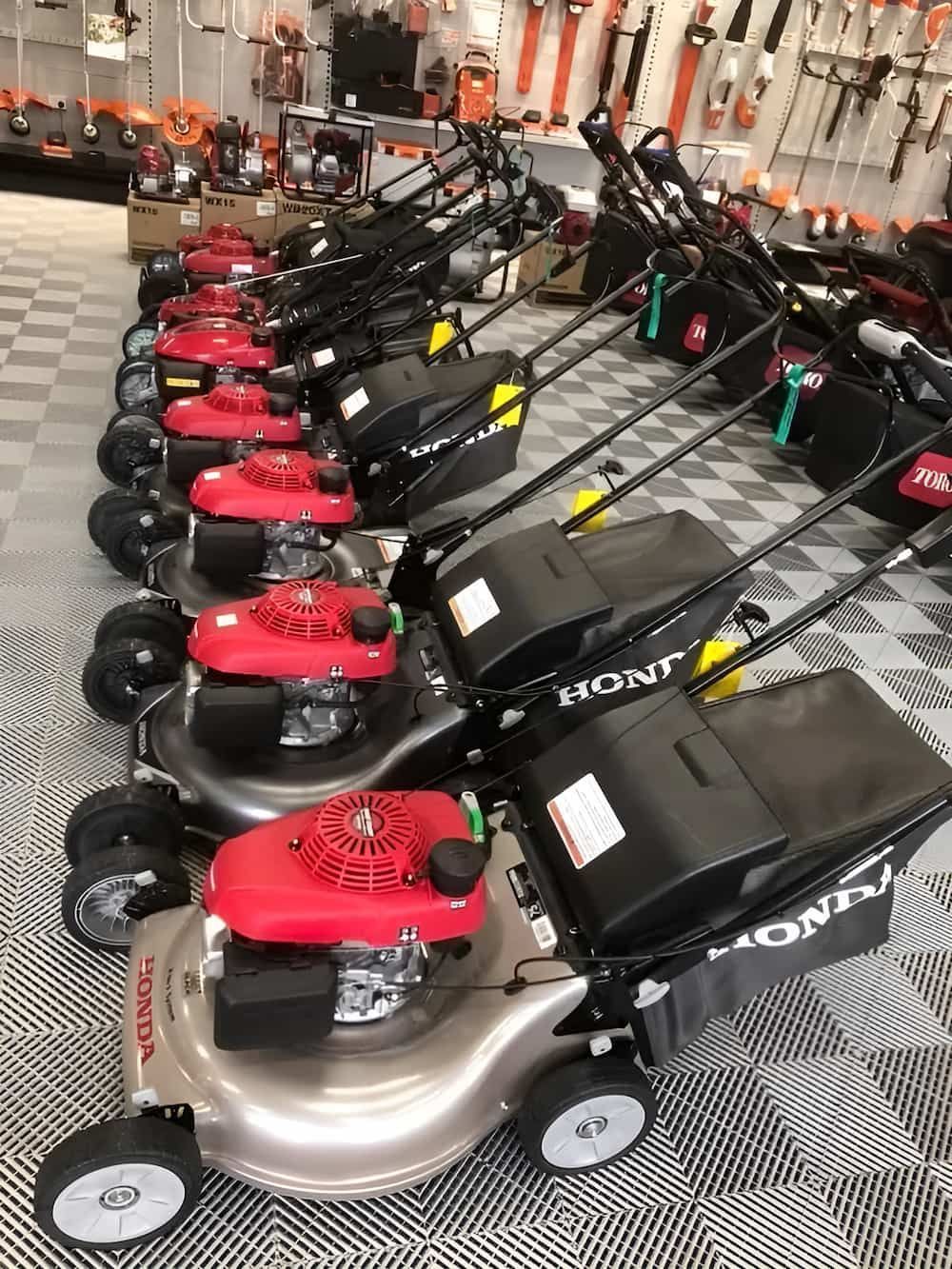 A Row of Honda Lawn Mowers Are Lined Up in a Store — Ireland's Machinery Pty Ltd In Braemar, NSW