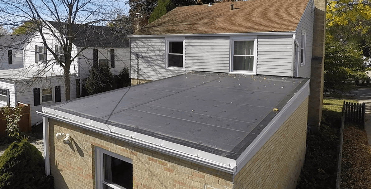 an aerial view of a house with a flat roof .