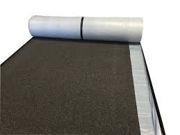 A roll of carpet is sitting on top of a table.