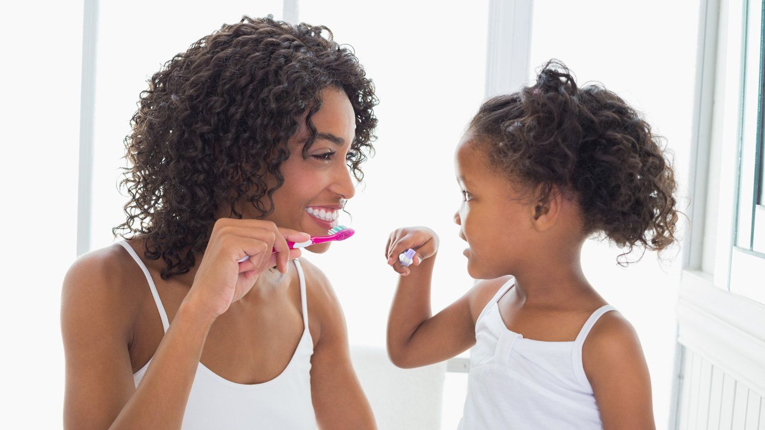 Mother And Child Brushing Teeth — Wilmington, DE — New Concept Dental